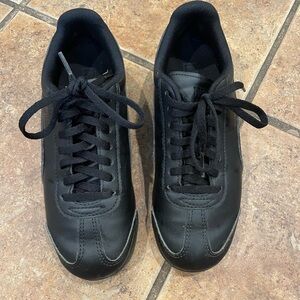 Puma Black Sneakers with Smooth Upper and Sleek Design